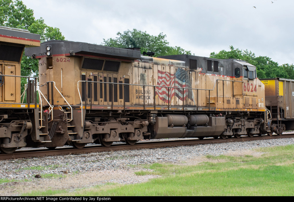 UP 6024 trails on a westbound coal train 